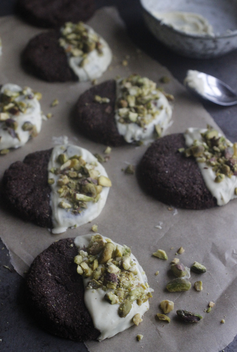 Chocolate, Cardamom & Pistachio Cookies Dipped in Raw White Chocolate