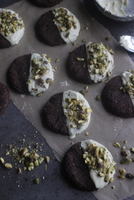 Chocolate, Cardamom & Pistachio Cookies Dipped in Raw White Chocolate
